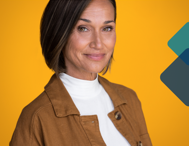 Woman looking into the camera with a knowing expression.