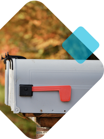 Outdoor residential mailbox against fall leaves background